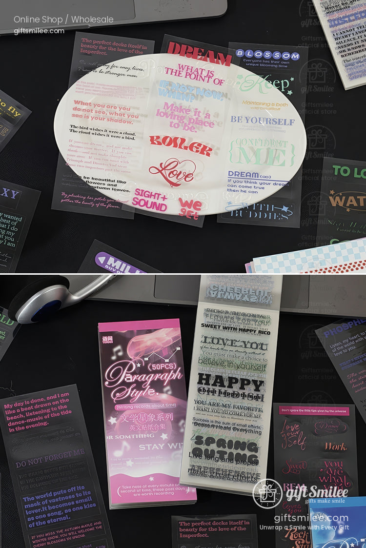 Assorted decorative typography stickers in various colors and fonts on a black surface with motivational texts