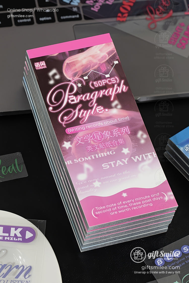 Stack of pink and black stationery cards with Paragraph Style text musical accents and glossy finish