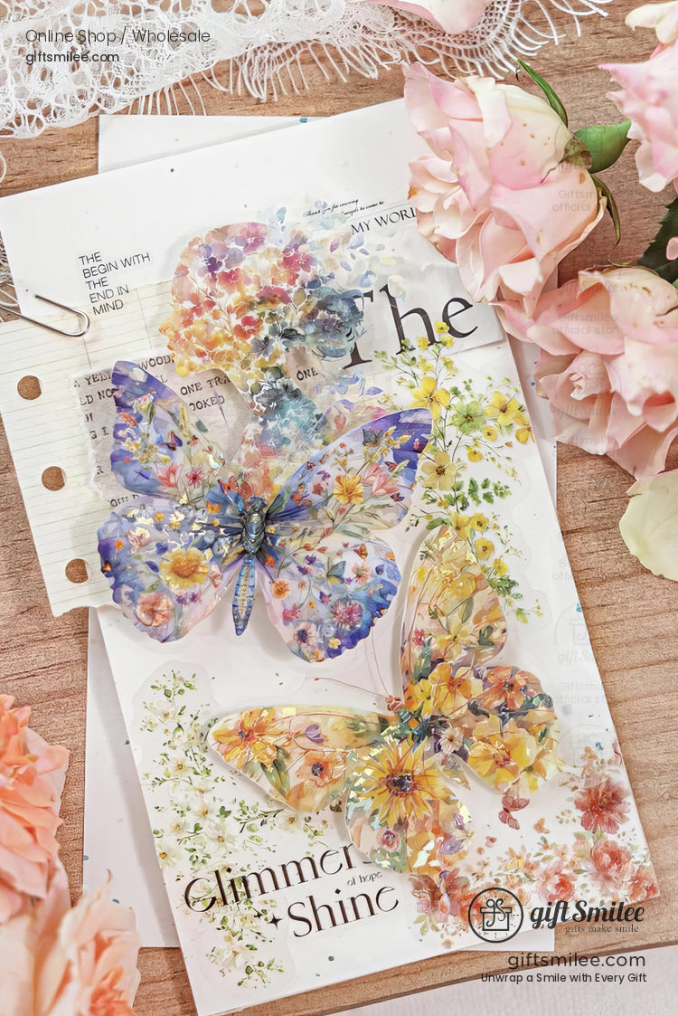 Vibrant floral butterfly stickers on glossy paper featuring intricate multicolor designs surrounded by soft pink roses