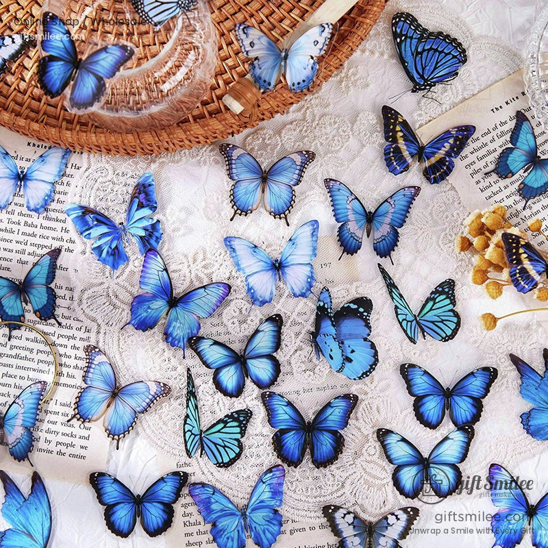 Vibrant blue butterfly stickers in various shades on lace woven straw hat and book pages with dried yellow flowers