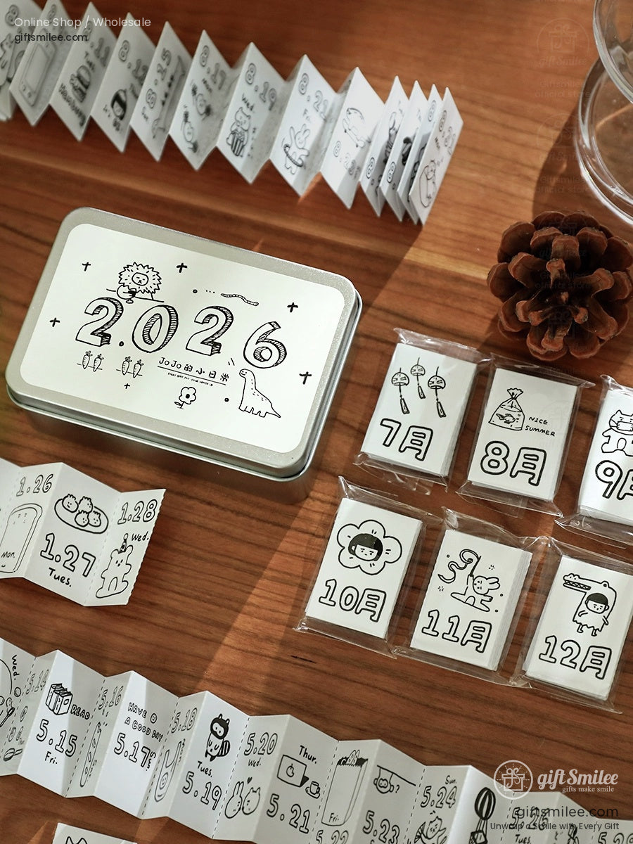 Minimalist 2026 planner set with blackandwhite cartoon illustrations compact folding calendar and tin storage box