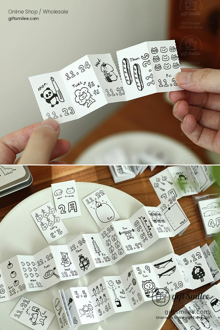 Blackandwhite mini paper calendar strips with handdrawn doodles of animals dates and objects on glossy material