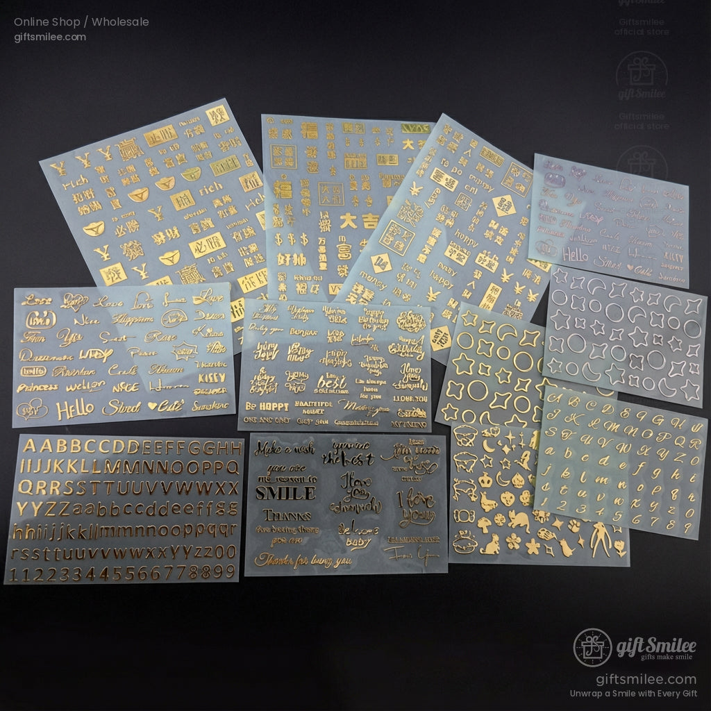 Clear adhesive nail art stickers with gold metallic designs including letters stars hearts and decorative phrases