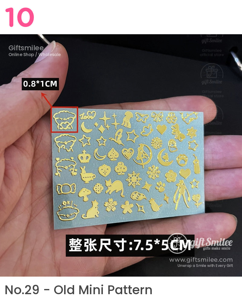 Gold metallic nail art stickers with various designs including stars animals and shapes on a 75x5 cm sheet