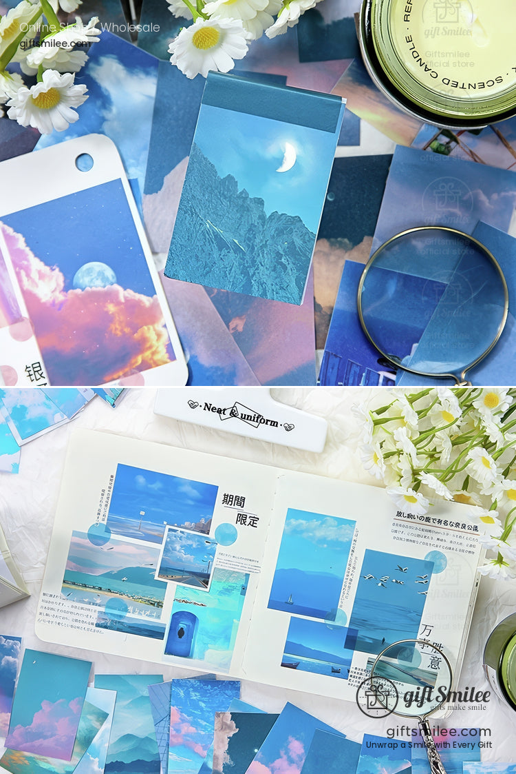 Assorted blue and pasteltoned skythemed stationery with moonlit mountains clouds and floral accents on a soft backdrop