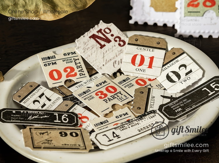 Vintagestyle paper ephemera set with numbered tickets retro fonts and neutral tones on a ceramic dish