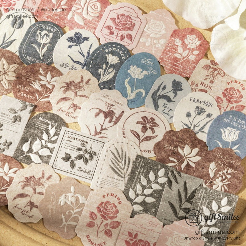 Vintage floralthemed paper stickers in muted red blue and beige tones featuring roses tulips and botanical designs