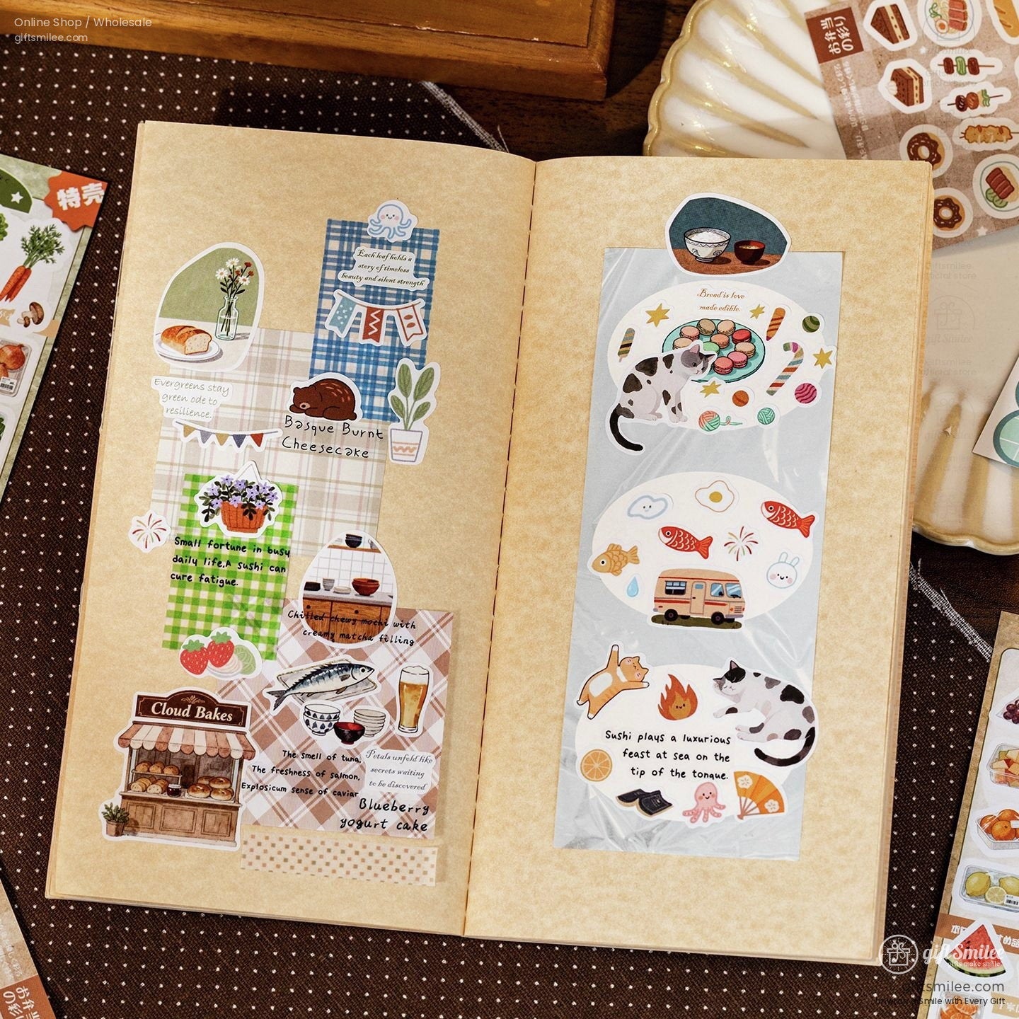 Vintagestyle open notebook with colorful food and animalthemed stickers including plaid patterns and handwritten text