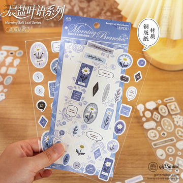 Transparent sticker sheets with blue floral and daisy designs speech bubble tags and soft botanical patterns