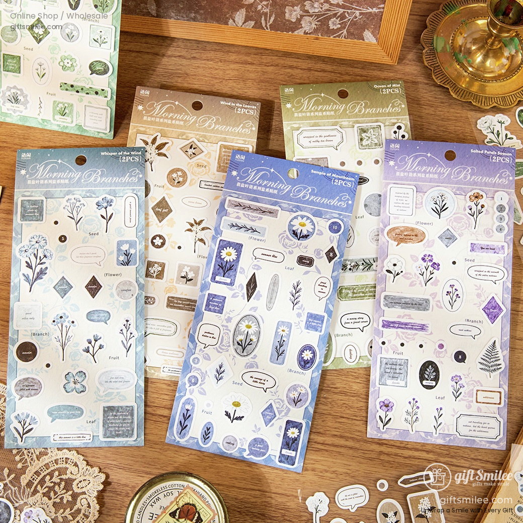 Assorted floralthemed sticker sheets with delicate botanical illustrations in pastel green blue and purple tones