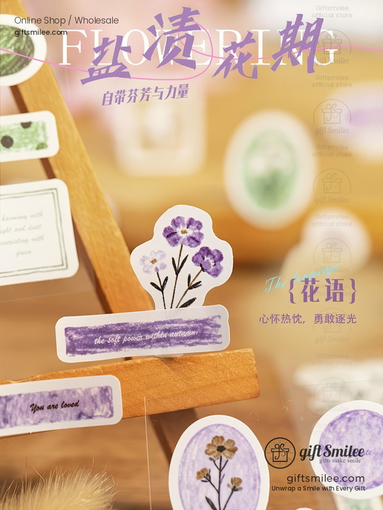 Pastel purple floral stickers with botanical designs on a wooden easel featuring inspirational text in delicate fonts