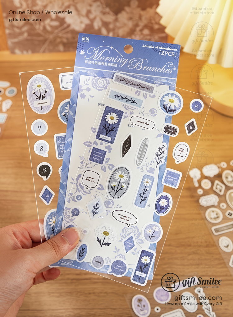 Transparent sticker sheets with blue floral designs daisies and decorative labels ideal for journaling or crafts