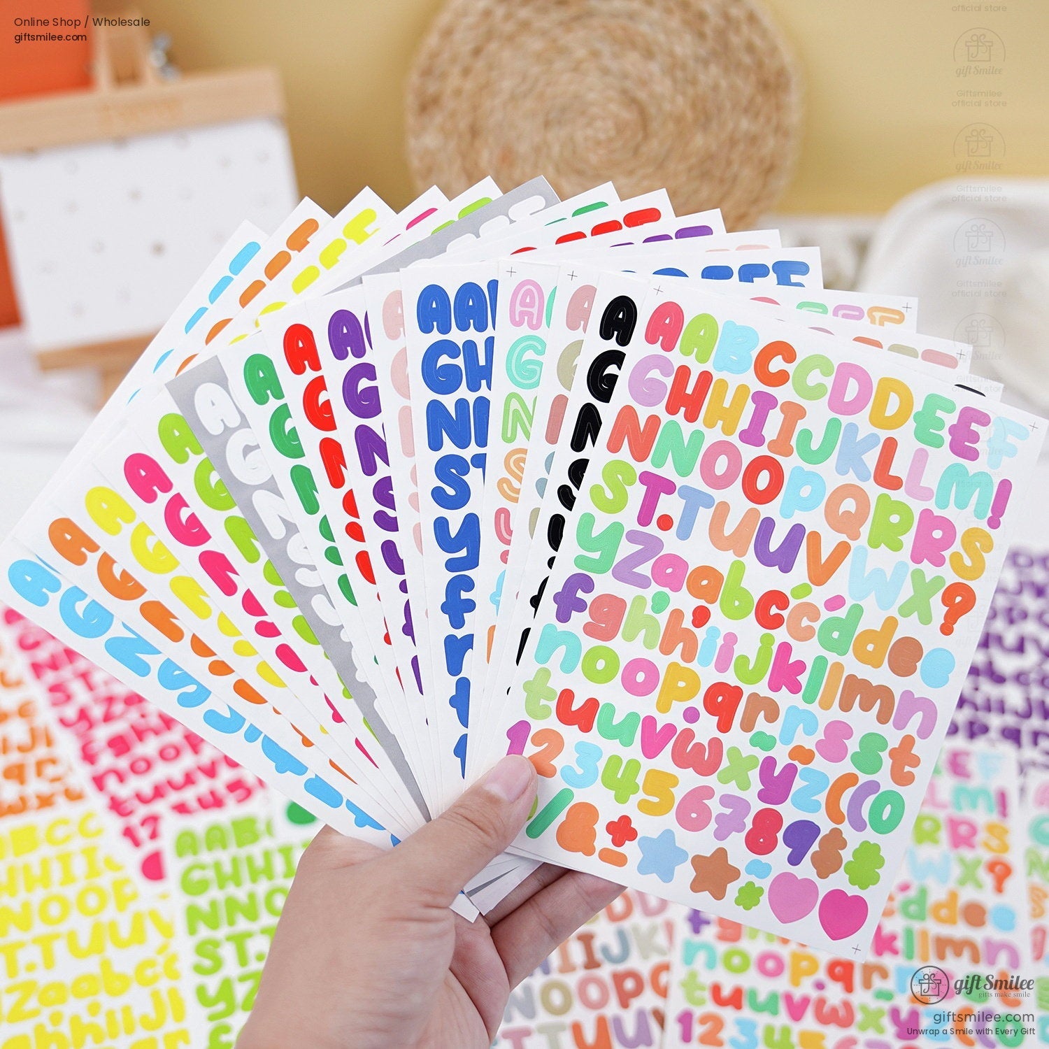 Colorful alphabet and number sticker sheets with bold uppercase and lowercase designs in assorted vibrant hues