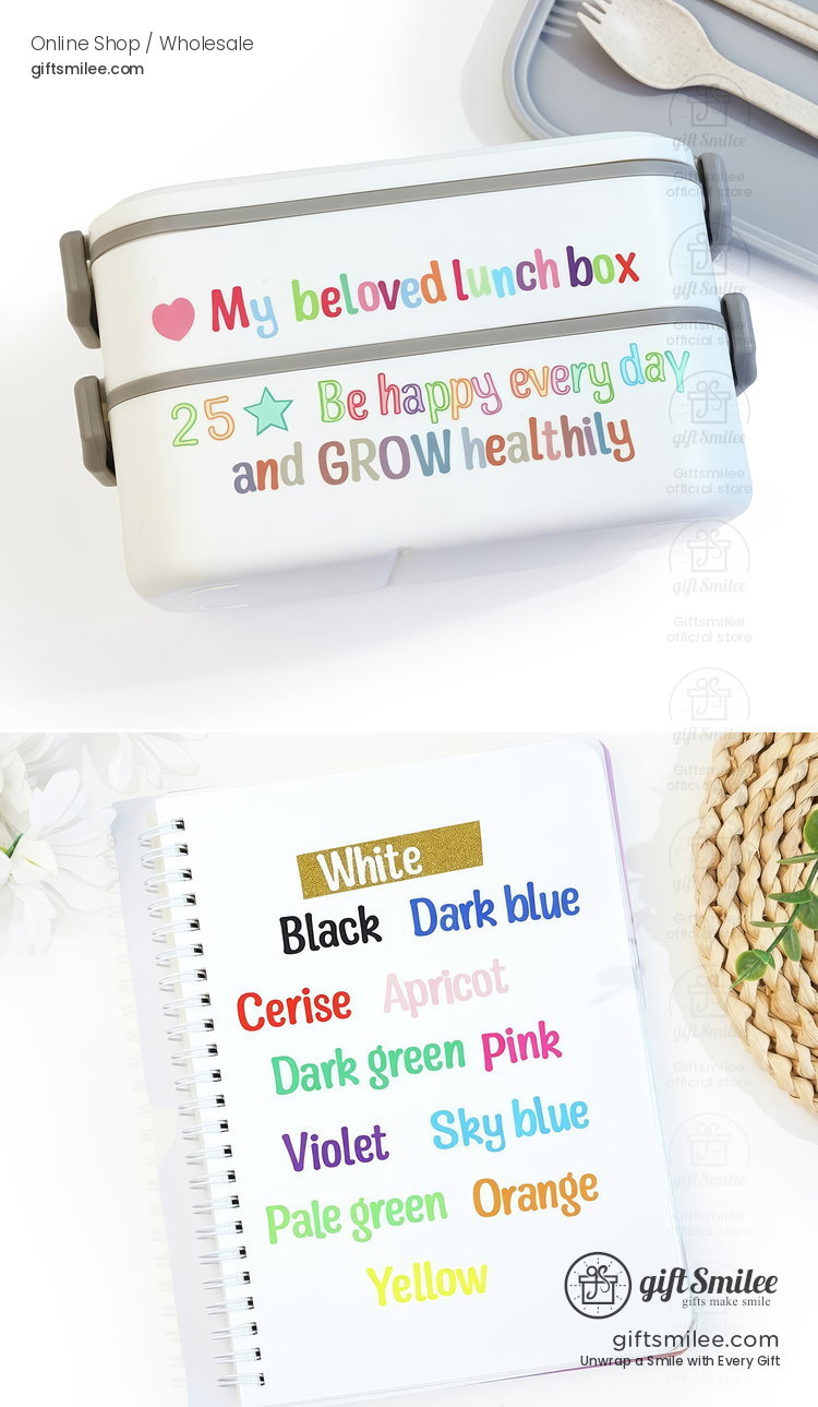 White bento lunch box with colorful motivational text gray side clasps and a matching utensil set on a tray