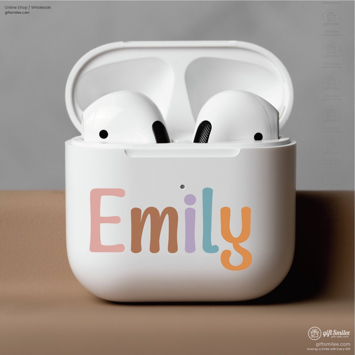 White wireless earbud case with colorful pastel Emily text design displayed open with sleek earbuds inside