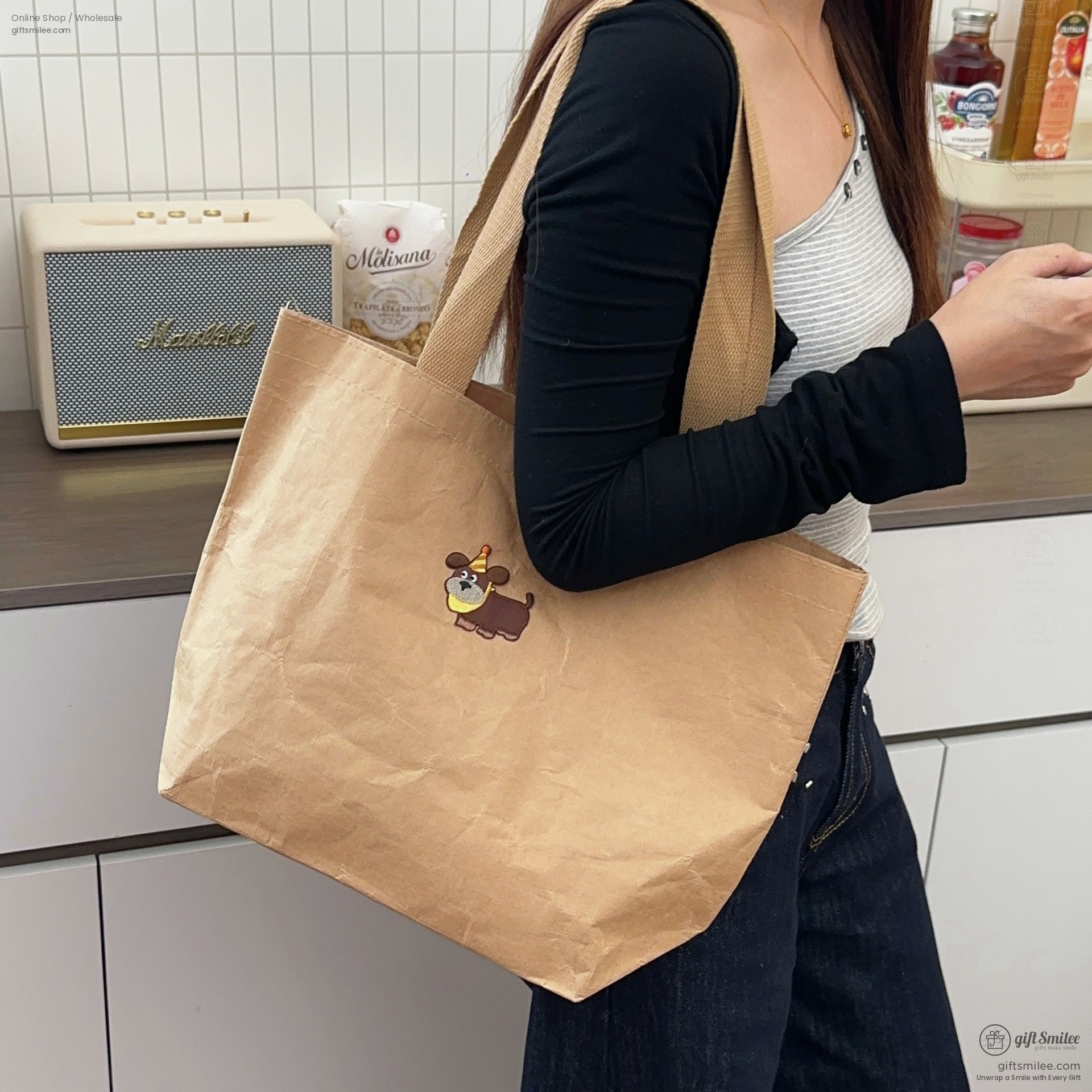 Light brown papertextured tote bag with a playful dog embroidery sturdy beige straps casual and ecofriendly design