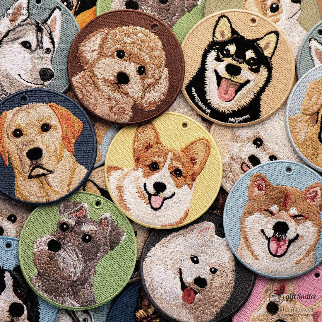 Round embroidered dog keychains with colorful fabric backdrops featuring various dog breeds and detailed stitching
