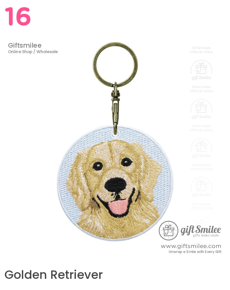 Round keychain with embroidered golden retriever face on light blue fabric brass clip and durable stitching